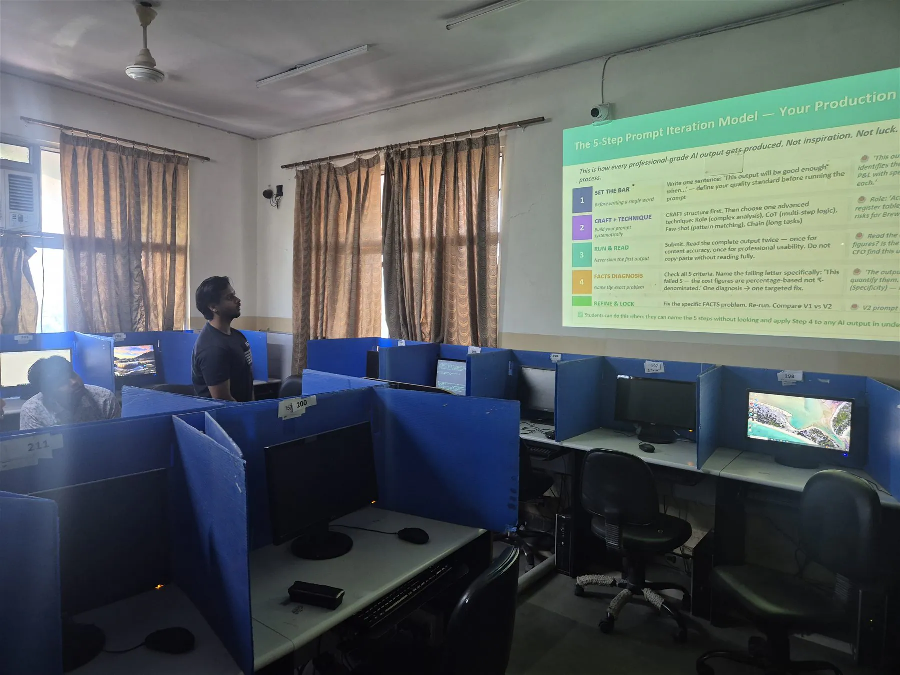 Facilitator leading an applied AI training session in a computer laboratory