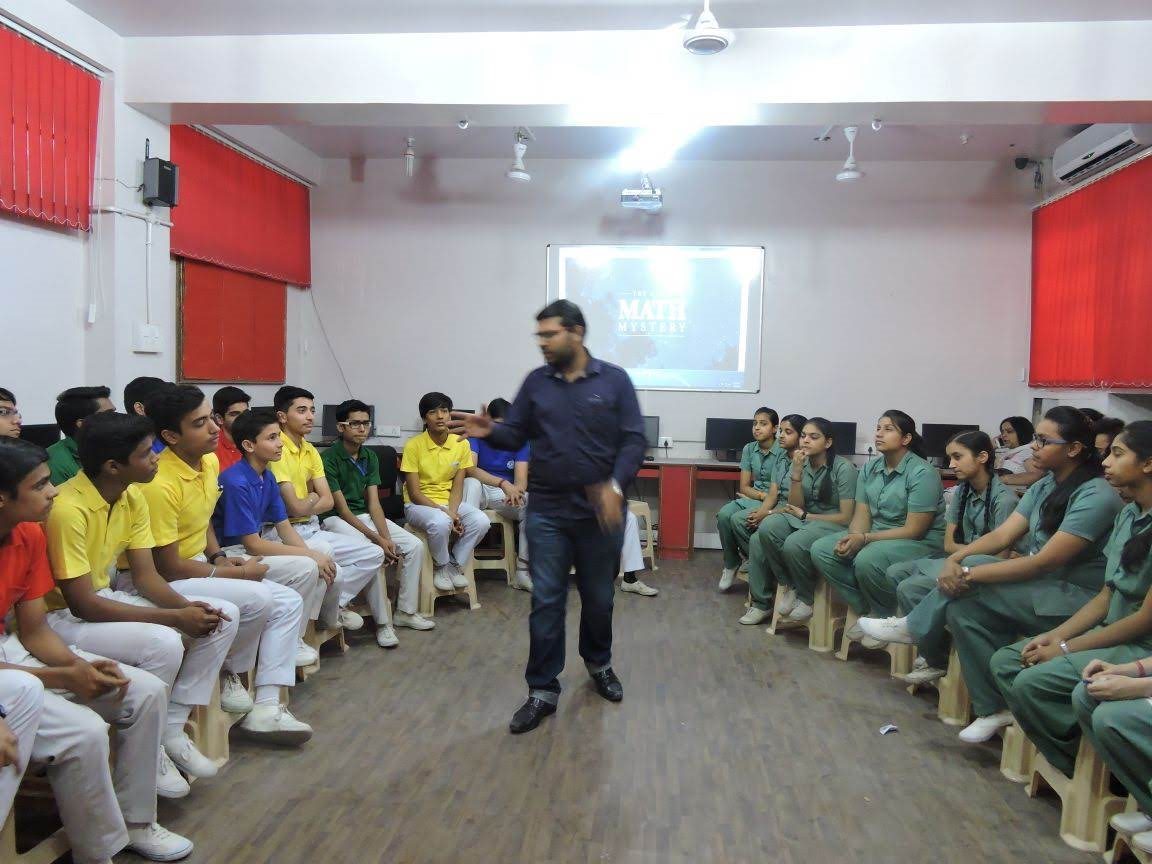 Facilitator leading an interactive learning session with school students